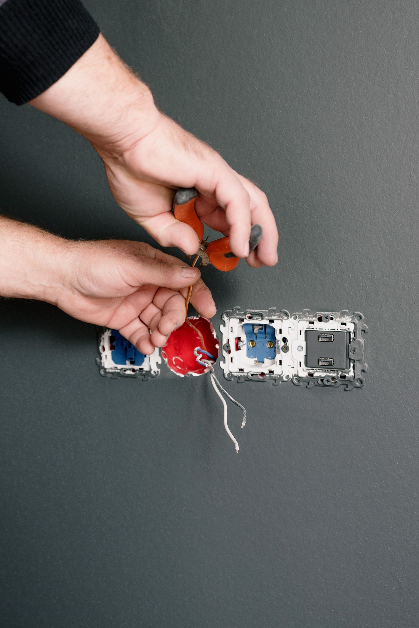Technician performing minor electrical and fixture maintenance